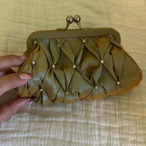 Gold iridescent evening small clutch with an attached silver chain strap
